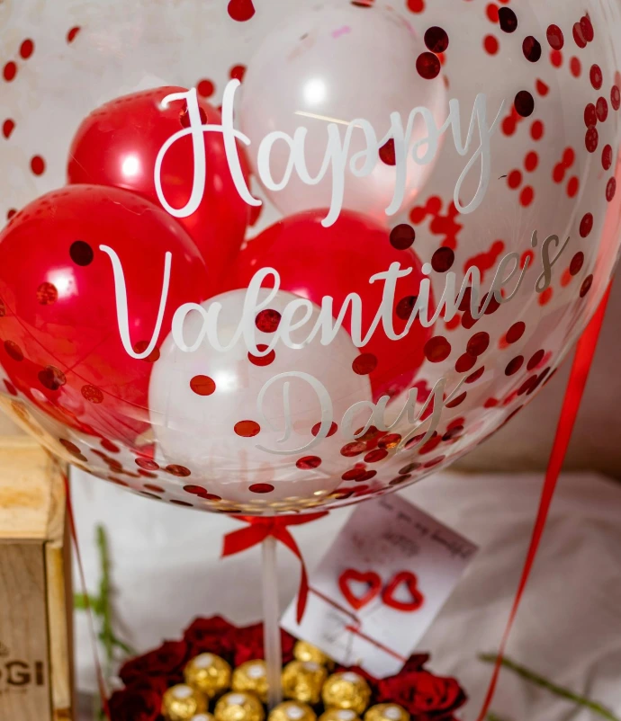 a bunch of balloons that are sitting on a table
